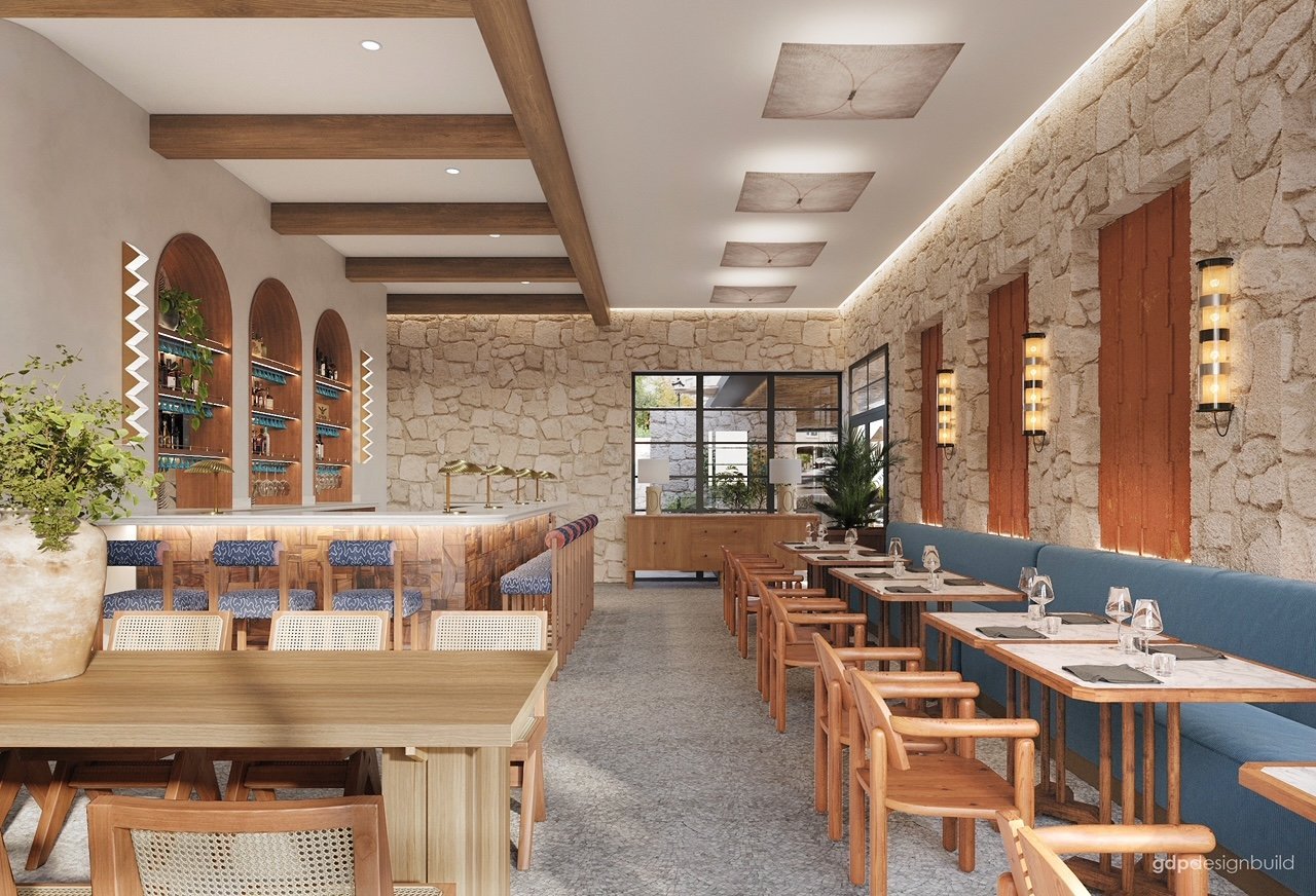 Modern cafe interior with wooden tables, stone walls, recessed lighting, and blue wall panels along dining area